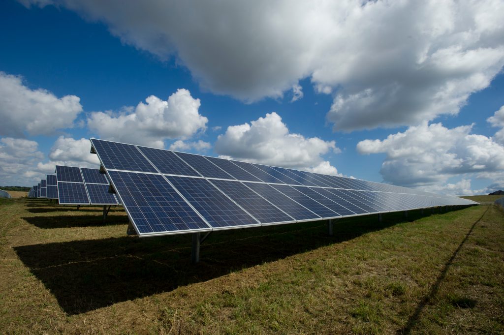 Sun and solar panels on the ground